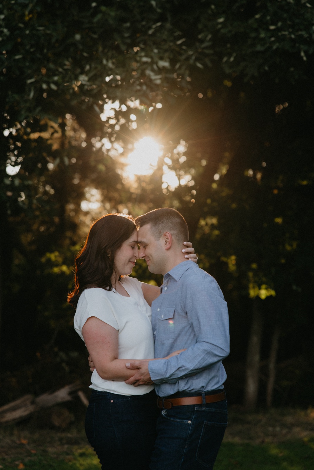 A golden-hour embrace under the trees