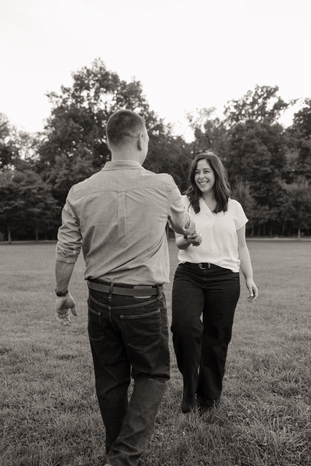 Walking through a field together, in black and white